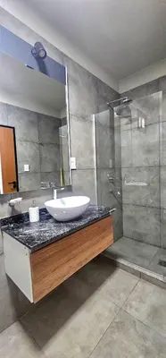 a bathroom with a sink and a shower at Casa Privada Los Cardenales in Nono