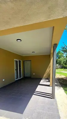 an empty house with a patio with a door at Casa Privada Los Cardenales in Nono
