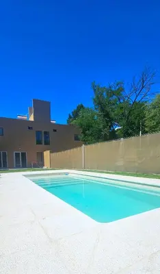 an empty swimming pool in front of a building at Casa Privada Los Cardenales in Nono