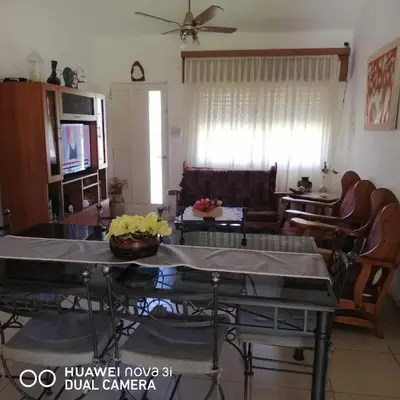 a living room with a couch and a table at La Linda in Villa Carlos Paz