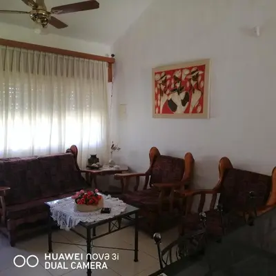 a living room with couches and a table at La Linda in Villa Carlos Paz