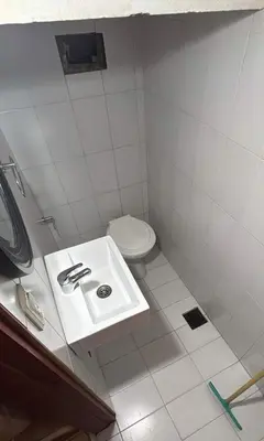a small bathroom with a sink and a toilet at Casa Expectacular cerca de la montaña in Villa Carlos Paz