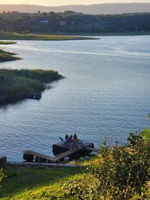 a group of people on a boat on a lake at Casa del lago los molinos in La Estancia