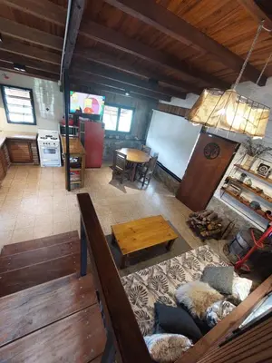 an overhead view of a kitchen and a living room at Casa del lago los molinos in La Estancia