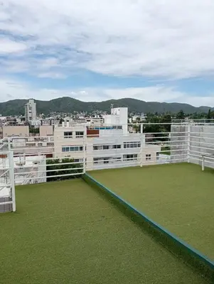 a balcony with a view of a city at Nenu Villa Carlos Paz Departamento Céntrico piscina in Villa Carlos Paz
