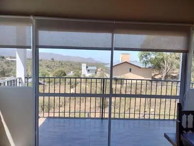 a view from the balcony of a house at Wualküre, acogedora cabaña en Villa General Belgrano in Villa General Belgrano