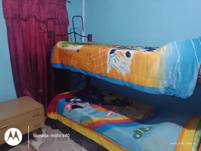 a bedroom with two bunk beds in a room at El Descanso in Nono