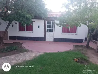 a house with a driveway and a white door at El Descanso in Nono