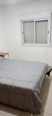 a bed in a white room with a window at Depto 1 Dorm Excelente Ubicacion Alta Cordoba Iluminado in Cordoba
