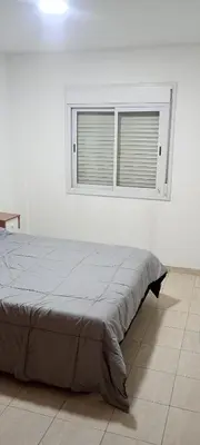 a bed in a white room with a window at Depto 1 Dorm Excelente Ubicacion Alta Cordoba Iluminado in Cordoba