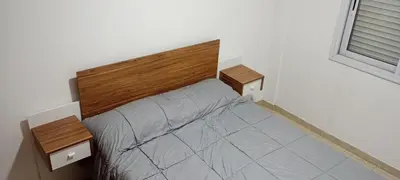a small bedroom with a bed with two night stands at Depto 1 Dorm Excelente Ubicacion Alta Cordoba Iluminado in Cordoba