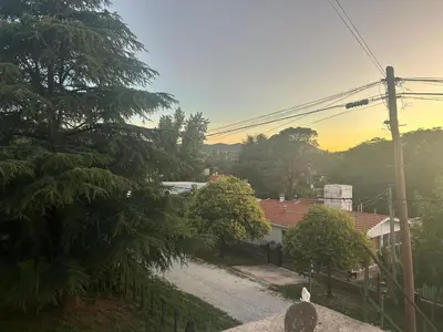 a view of a house with trees and a street at Cocoalojamiento in Cavalango