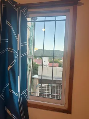 a window with a view of a city at Cocoalojamiento in Cavalango