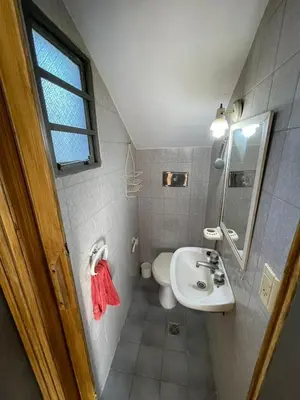 a small bathroom with a sink and a toilet at Casa de Alvita in Villa Carlos Paz