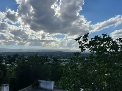 a view of a city under a cloudy sky at Casa de Alvita in Villa Carlos Paz