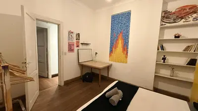 a room with a desk and a painting on the wall at Home lab studio in Cordoba