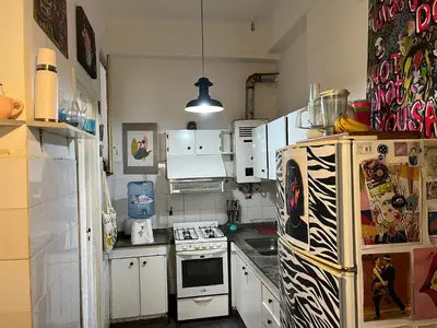 a kitchen with a refrigerator and a stove at Home lab studio in Cordoba