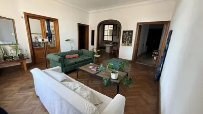 a living room with a couch and a table at Home lab studio in Cordoba