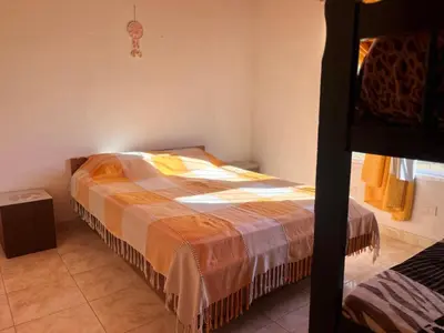 a bedroom with a bed in a room at Timtaya in Barrio Parque El Corcovado