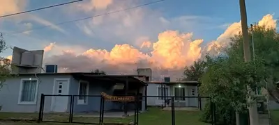 a large group of clouds in the sky above a house at Timtaya in Barrio Parque El Corcovado