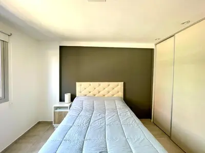 a bedroom with a large bed in a room at Nova Vita in Cordoba