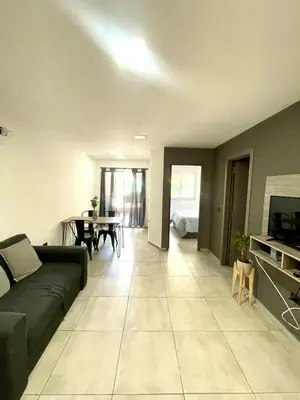 a living room with a couch and a table at Nova Vita in Cordoba