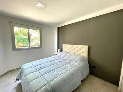 a bedroom with a large bed with a window at Nova Vita in Cordoba