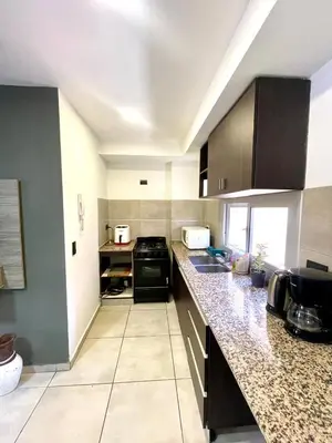 a large kitchen with a counter top and a counter top at Nova Vita in Cordoba