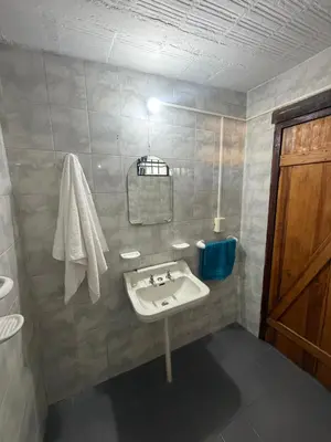 a bathroom with a sink and a toilet at Casita de campo in Las Calles