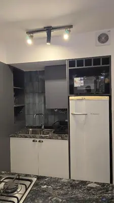a kitchen with a sink and a counter top at ALV26 4G -Departamento Sobremonte in Cordoba