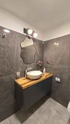 a bathroom with a sink and a mirror on the wall at ALV26 4G -Departamento Sobremonte in Cordoba
