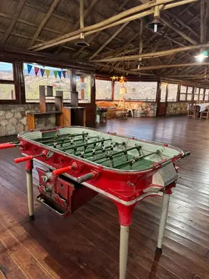 a pool table in the middle of a room at Cabaña Los Nogales- Naturaleza y relax en Altas Cumbres in Arroyo de Los Patos