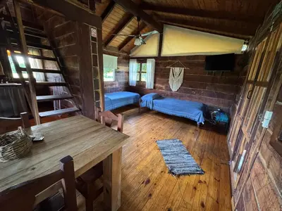 an aerial view of a living room in a log cabin at Cabañas El Atalaya in Villa Rumipal