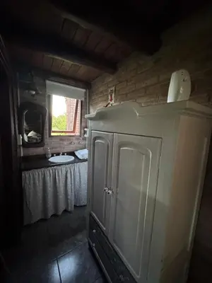 a bathroom with a sink and a counter in a room at Cabañas El Atalaya in Villa Rumipal