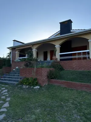 a brick house with a brick staircase in front of it at Casa de campo Marines in San Antonio de Arredondo