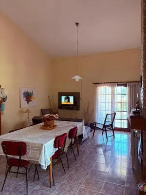 a large living room with a table and chairs at Casa de campo Marines in San Antonio de Arredondo