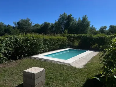 a small swimming pool in the grass in a yard at Timtaya in Barrio Parque El Corcovado