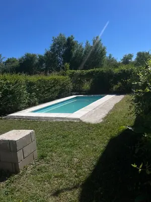 a swimming pool in the middle of a yard at Timtaya in Barrio Parque El Corcovado