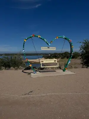 a heart shaped arch in front of a bench at Timtaya in Barrio Parque El Corcovado