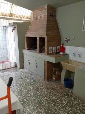 a kitchen with a brick oven in a room at Hermosa Casa equipada a metros del Río Cosquín in Bialet Massé