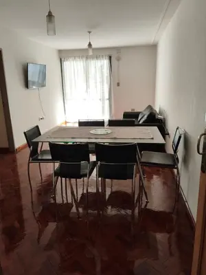 a dining room with a table and chairs at Hermoso Dpto Nva Cordoba in Cordoba
