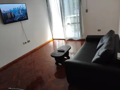 a living room with a couch and a coffee table at Hermoso Dpto Nva Cordoba in Cordoba