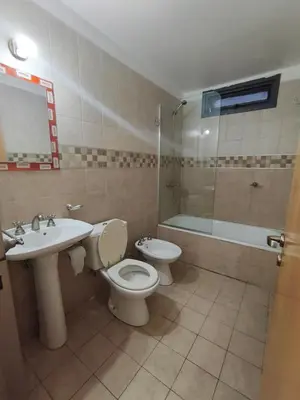 a bathroom with a toilet and a sink and a shower at Hermoso Dpto Nva Cordoba in Cordoba