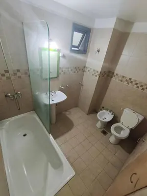 a bathroom with a tub and a toilet and a sink at Hermoso Dpto Nva Cordoba in Cordoba