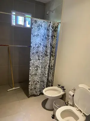 a bathroom with a toilet and a shower at Loft serenity in Villa Carlos Paz