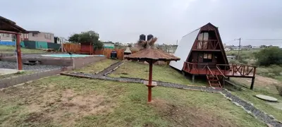 a small playground with a tent and a play area at El arroyense in Cordoba