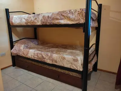 a couple of bunk beds in a room at No tiene nombre in Mina Clavero