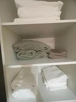 a closet filled with towels and folded towels at Beautiful y sofisticado apartment in Cordoba
