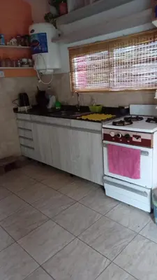 a kitchen with a stove and a counter top at La casita in Villa Santa Cruz del Lago