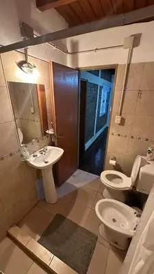 a bathroom with a toilet and a sink at Loft estilo rustico Alta Cba Wifi 100Mb y Escritorio in Cordoba